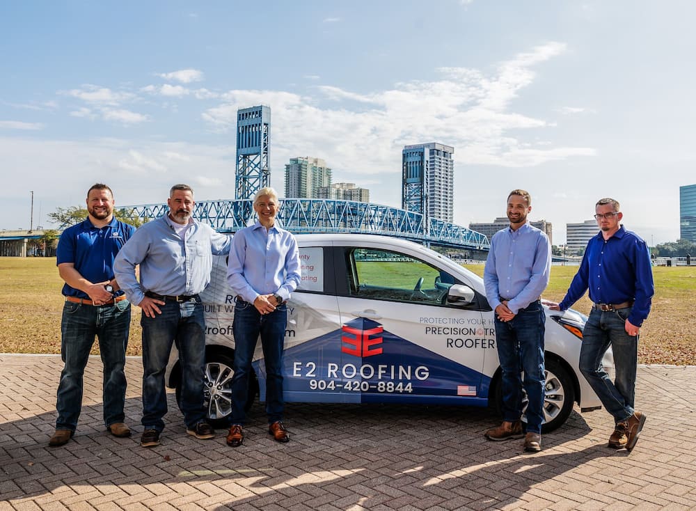 Team Photo Next to Vehicle